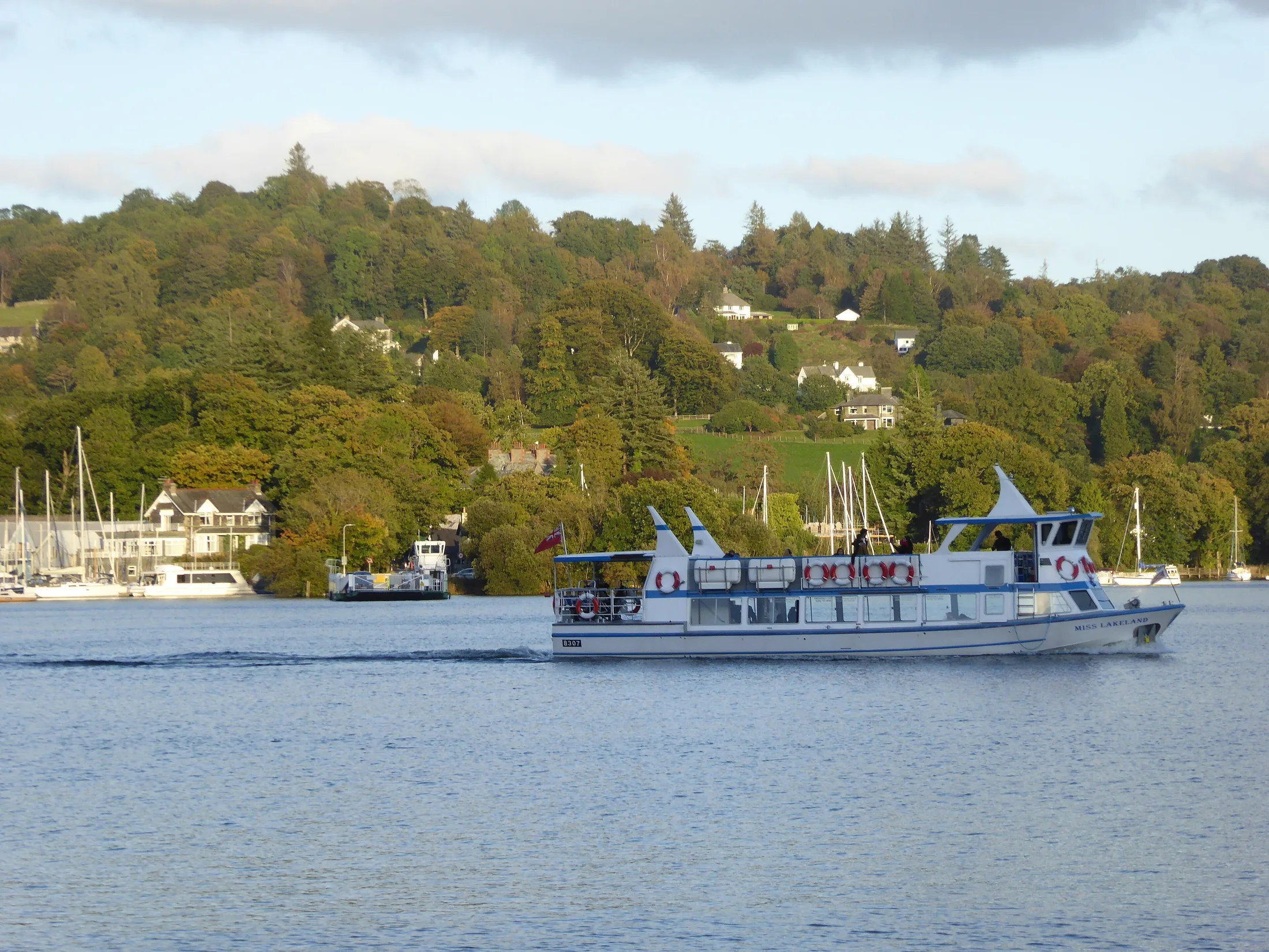 A Windermere Lake Cruises boat on the lake in autumn
