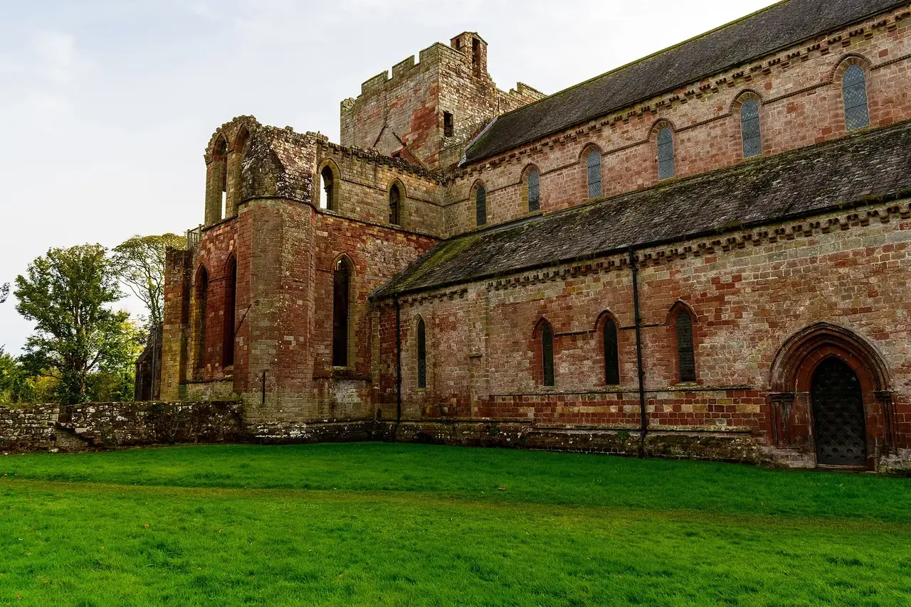 The church at Lanercost, still in parish use, beside the ruined priory