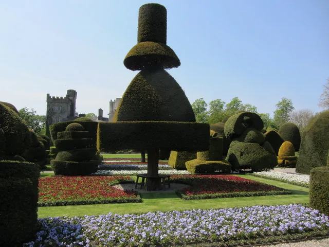 Giant topiary shapes above bright bedding
